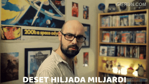 a man with glasses and a beard says deset hiljada miljardi in front of a bookshelf