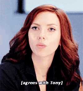 a close up of a woman 's face with the words agrees with tony