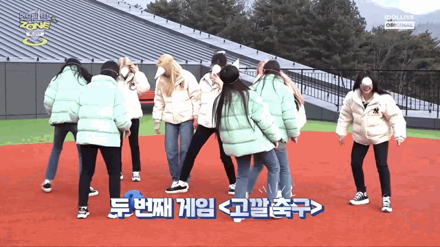 a group of girls are dancing in front of a sign that says ipollive