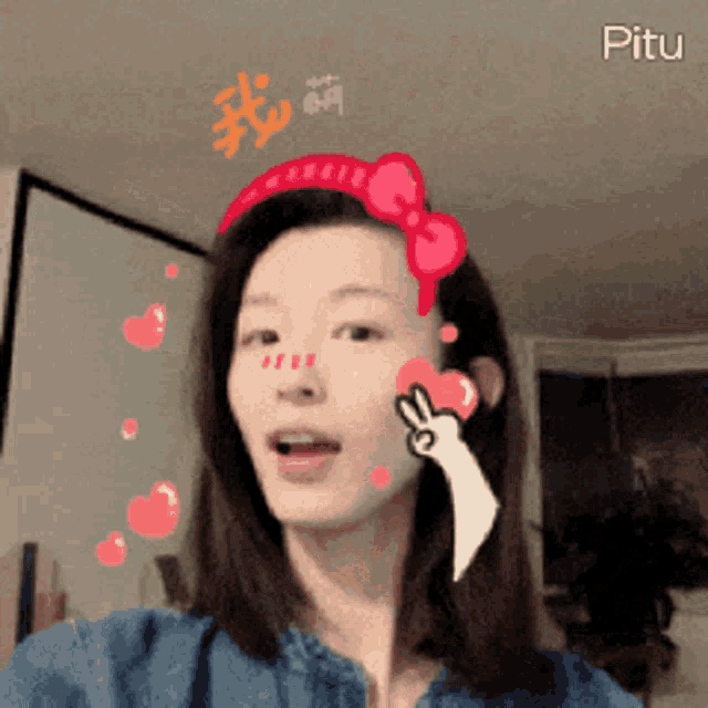 a woman is wearing a headband with a hello kitty bow