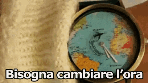 a watch with a map of the world on it and the words bisogna cambiare l' ora