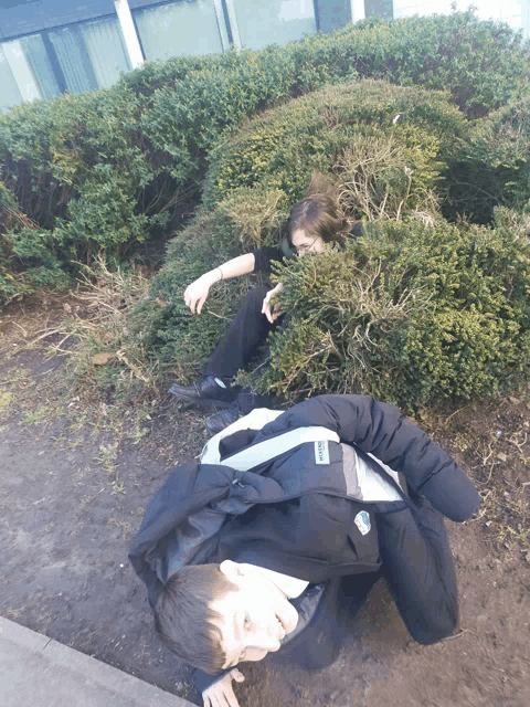a boy wearing a black jacket with a backpack that says ' adidas ' on it