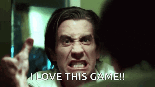 a man is making a funny face and says `` i love this game '' .