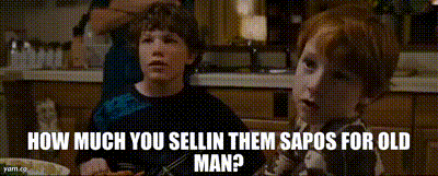 two young boys are sitting at a table with the words how much you sellin them sapos for old man