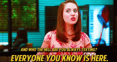 a woman in a pink shirt is talking to someone and says everyone you know is here