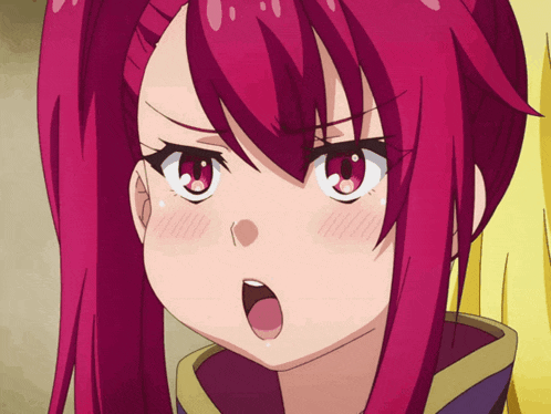 a close up of a girl 's face with red hair