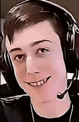 a young man wearing headphones and a microphone is smiling