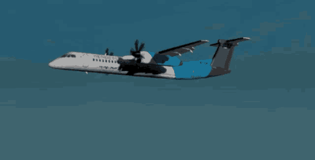 a blue and white airplane with the letters tcx on the tail is flying in the sky
