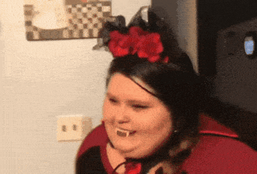 a woman wearing a vampire costume with a crown on her head