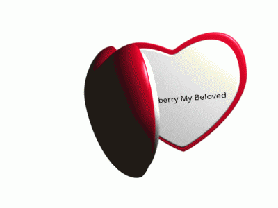 a heart shaped mirror with woodieberry my beloved written on the inside