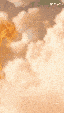 a dragon is flying through a cloudy sky with the caption copcut