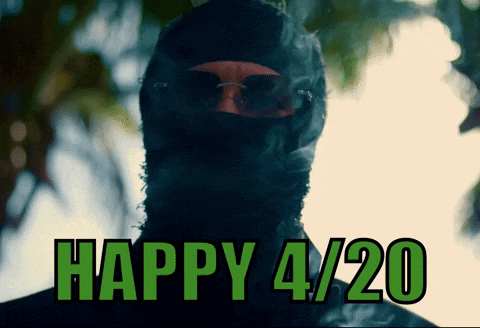 a man wearing a black mask and sunglasses says happy 4/20