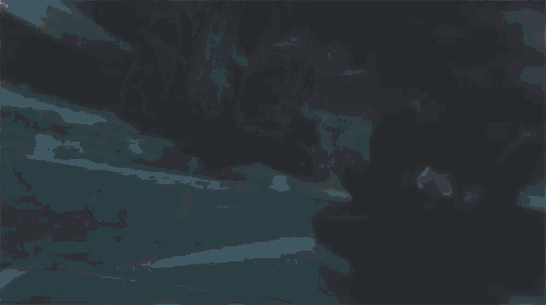 a silhouette of a man carrying another man on his back with blood splashing around them