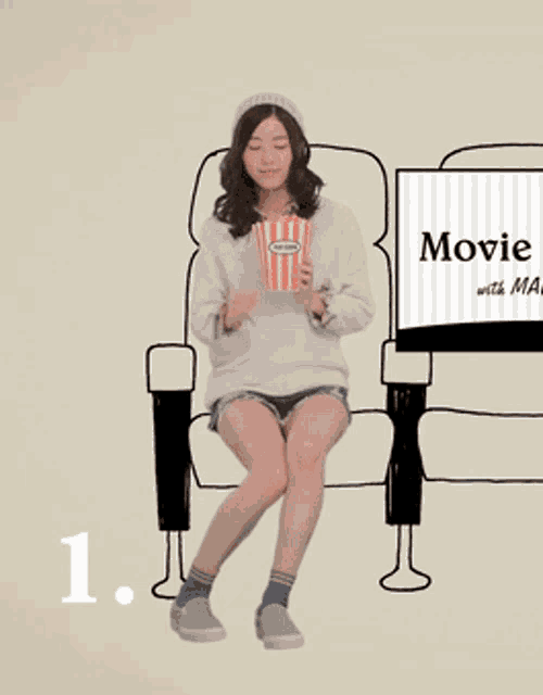 a woman is sitting in a chair holding a bag of popcorn in front of a sign that says movie with ma