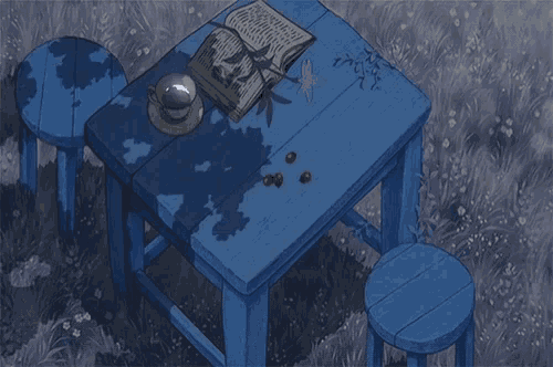 a blue table with an open book on it