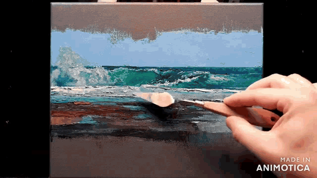 a person is painting a picture of the ocean and the words made in animotica are below it