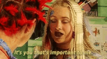 a woman with red hair says " it 's you that 's important to me " to another woman