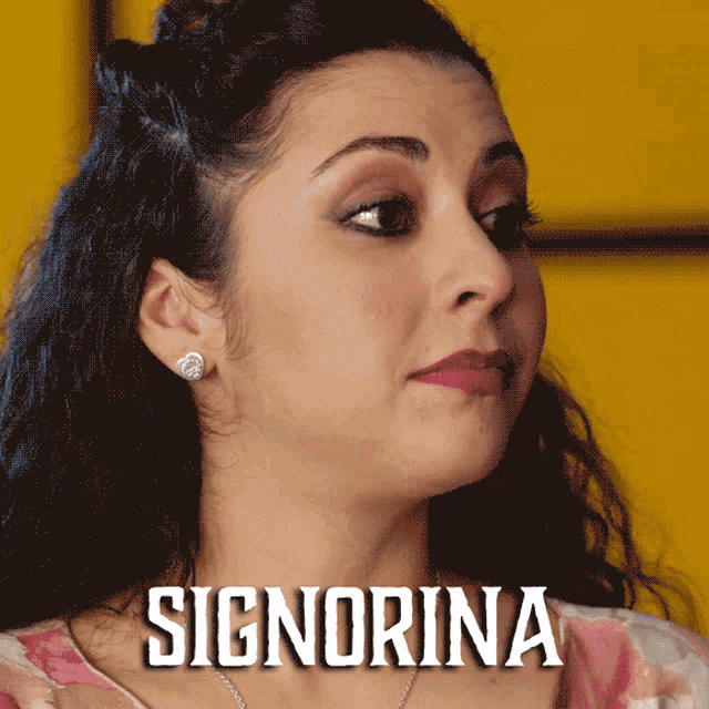 a close up of a woman 's face with the name signorina on the bottom