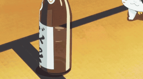 a cartoon cat is standing next to a bottle of beer on a table .