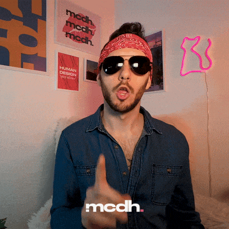 a man wearing sunglasses and a bandana is giving a thumbs up in front of a wall with posters that say mcdh