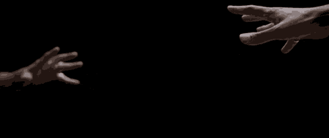 a couple of hands reaching out towards each other