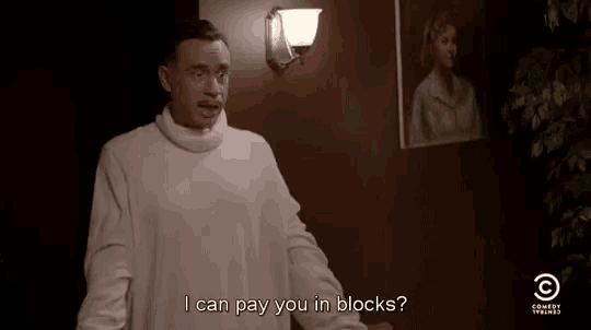 a man in a white sweater says " i can pay you in blocks ? "