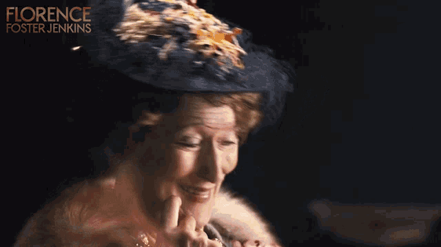 a poster for florence foster jenkins shows a woman wearing a hat and fur coat