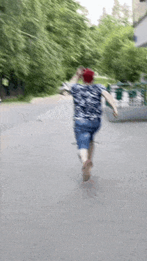 a blurry image of a person running down a street