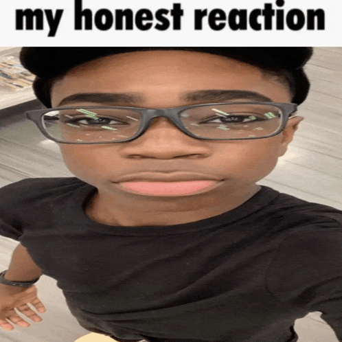 a young man wearing glasses and a black shirt with the words " my honest reaction " written above him