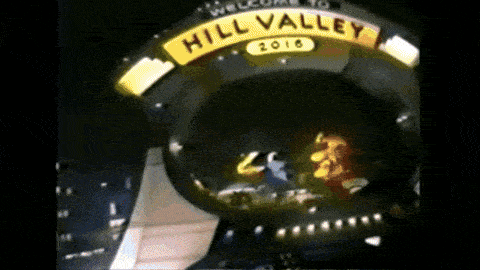a sign that says hill valley 2016 is lit up in the dark