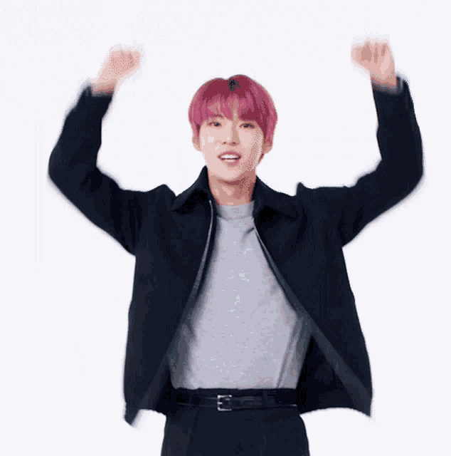 a young man with pink hair is wearing a black jacket and a gray shirt