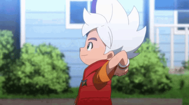 a boy with white hair and a red jacket is standing in front of a blue building