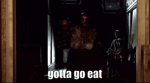 a man in a top hat is standing in a doorway with the words gotta go eat behind him
