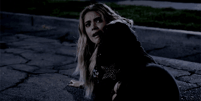 a woman is screaming with her mouth open and her tongue sticking out