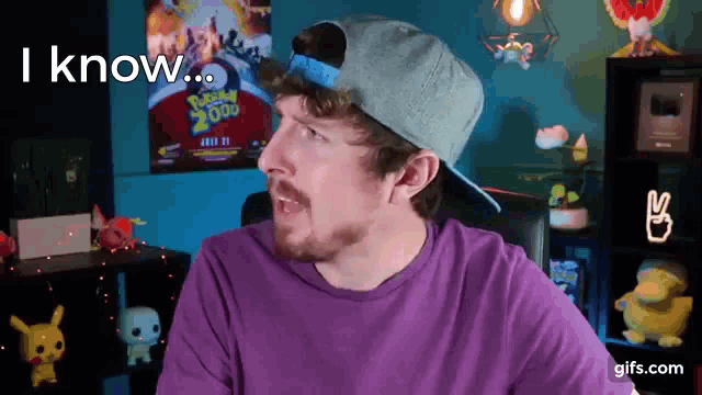 a man wearing a hat and a purple shirt says i know ..