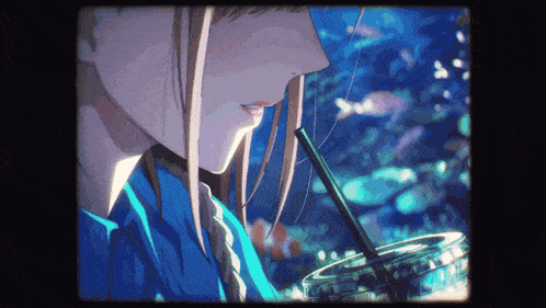 a girl in a blue shirt is drinking from a plastic cup with a straw