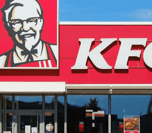 the front of a kfc restaurant with a large sign on it