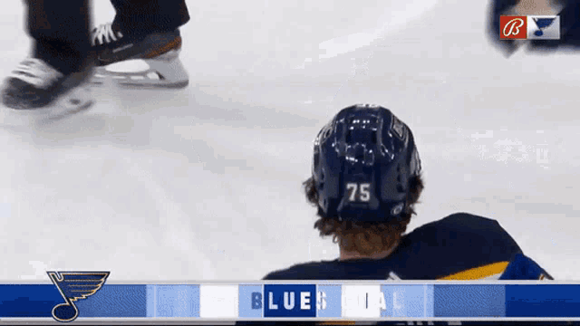 a hockey player with the number 75 on his back