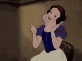 snow white from snow white and the seven dwarfs is sitting on a chair waving .
