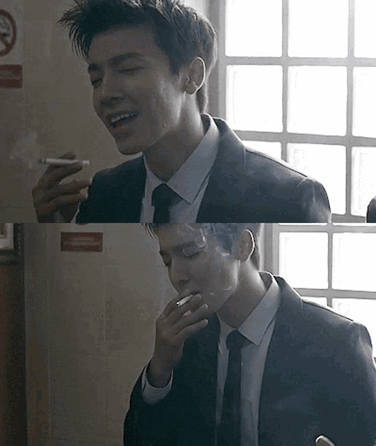 a man in a suit and tie is smoking a cigarette in front of a no smoking sign