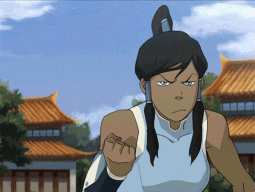 a woman in a blue tank top is giving a middle finger