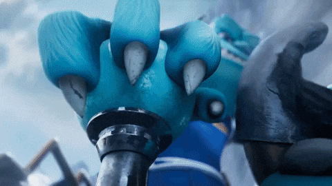 a close up of a blue monster 's claw with sharp claws