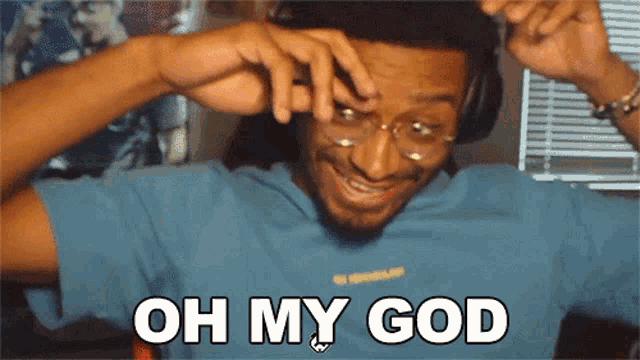 a man wearing glasses and headphones is smiling and says oh my god