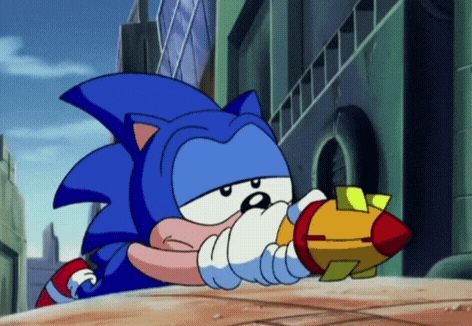 a cartoon of sonic the hedgehog holding a rocket in his hand .