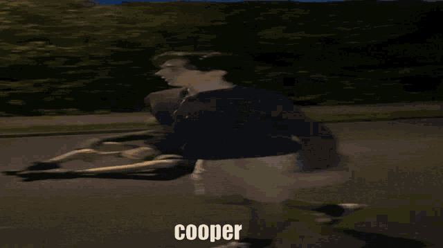 a blurry photo of a person with the word cooper on the bottom right