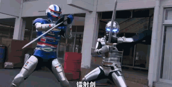 two robots are fighting each other with swords in front of a building .