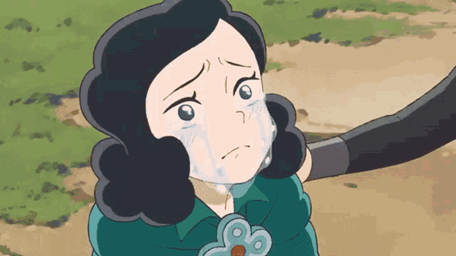 a cartoon girl is crying while being held by someone