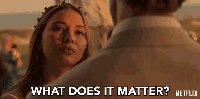 a woman looking at a man with the words what does it matter netflix written below her