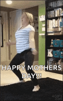 a pregnant woman is dancing on a rug in a living room on mother 's day .