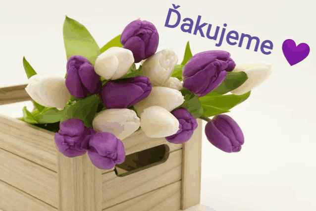 a bouquet of purple and white flowers in a wooden box with the words " dakujeme " above them